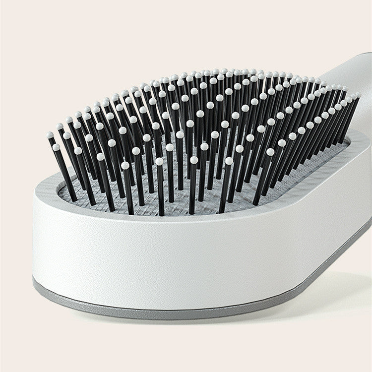 "Self-Cleaning Hair Brush for Women with Scalp Massage & Anti-Static Features"