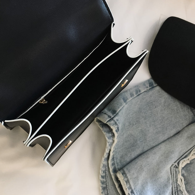 Elegant Designer Handbag with Diamond Lock