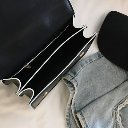 Elegant Designer Handbag with Diamond Lock